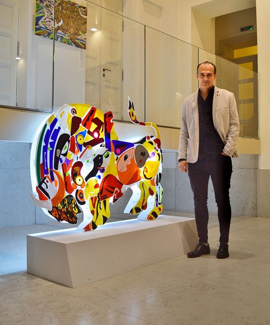 Artist Marko Gavrilovic with his bull light sculpture Infinity